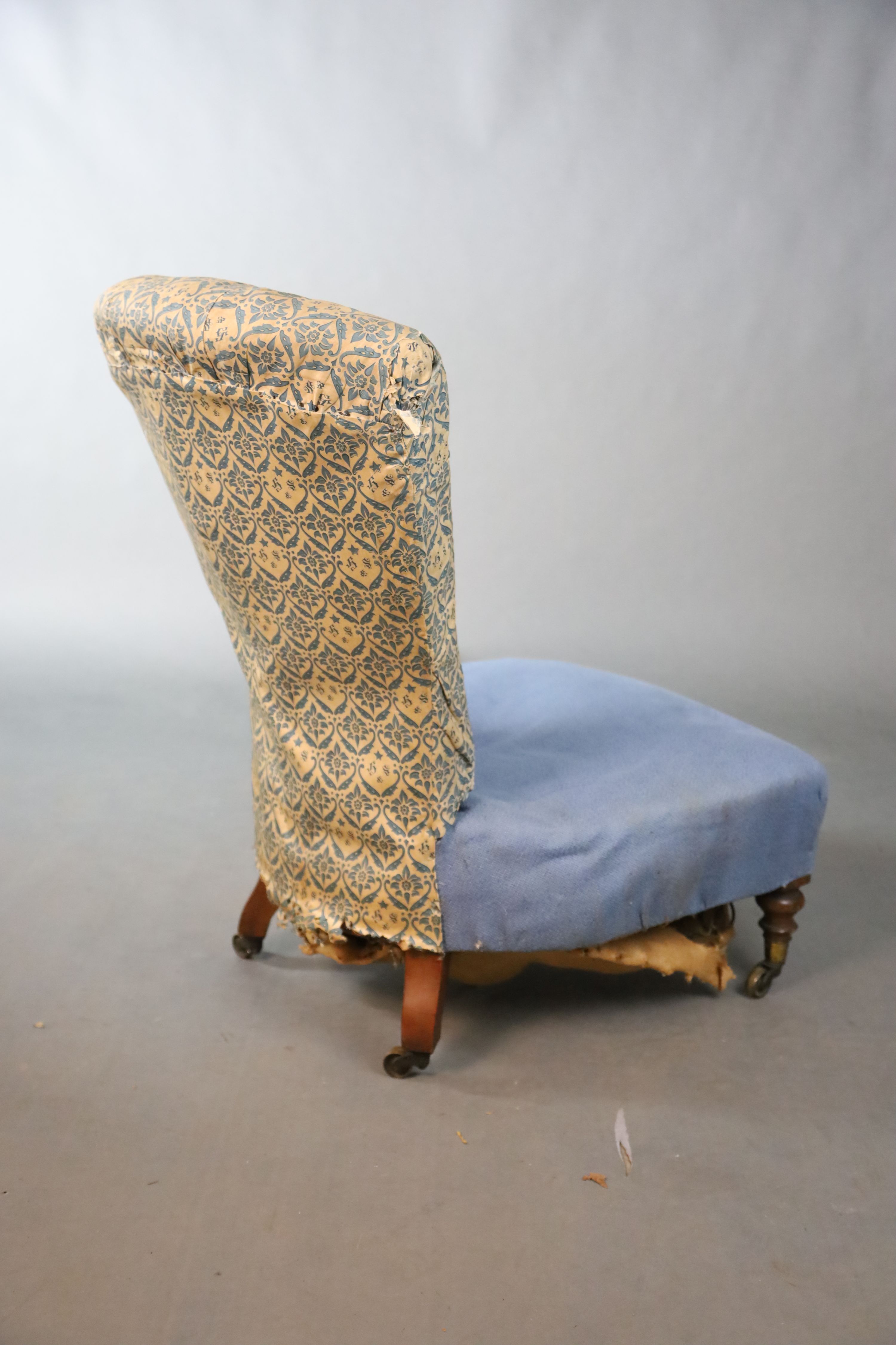 A Victorian Howard & Sons walnut buttoned back nursing chair, W.58.5cm D.81.5cm H.86.5cm